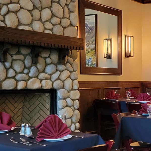 A picture of the brand new Kilmorey Lodge Dining Room and fireplace in the afternoon.